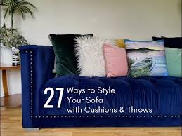 style a sofa with cushions throws