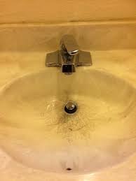 bathroom sink with deep dirty stains