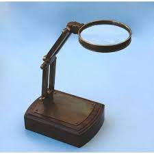 Brown Brass Magnifying Glass On Wooden Base