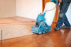 hardwood floor restoring worker