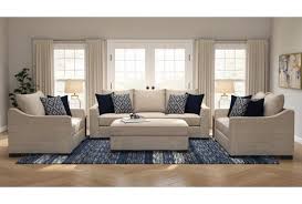 Beige Sofa With Blue Pillows On