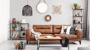 the trenst ways to style a brown sofa