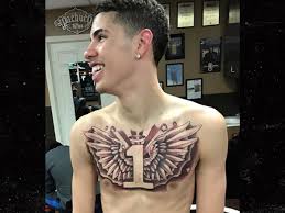 Oh he is but lonzo is still a millennial so i'll give him a pass. Lamelo Ball Gets Massive Chest Tattoo