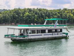 This houseboat also has 2 bathrooms with showers, a full kitchen, television with dvd, a flybridge with canopy, central air condtioning, a full size refrigerator, a large deck cooler. Dale Hollow Lake Houseboats Rentals Houseboat Rentals Houseboat Vacation House Boat