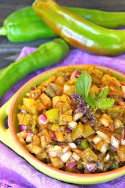roasted double hatch chile pineapple salsa recipe in a light green teracotta rimmed round
