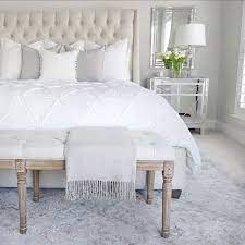 The scandinavian style immediately comes to mind in this case, given the fact that it's based mostly on consider using different types of textures and finishes when furnishing a space with white pieces, just to avoid creating a monotonous and boring decor. Bedroom Inspo Tufted Linen Bed Mirrored Nightstand White Bedding Tufted Linen Bench Gray Safavieh Rug Benjami Classic Bedroom White Bedding Home Bedroom