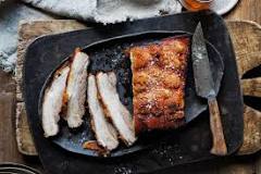 Why do you pour boiling water on pork belly?