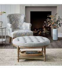 Kick up your feet and rest them on top of one of these ottomans. Round Grey Fabric Tufted Coffee Table Ottoman With Bottom Shelf