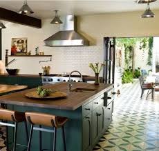 House Call Commune In La Remodelista Indoor Outdoor Kitchen Dark Green Kitchen Kitchen Flooring