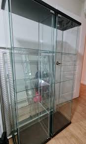 2 Ikea Detolf Glass Door Cabinets In