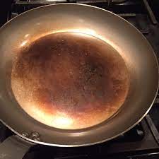 seasoning a carbon steel pan or wok
