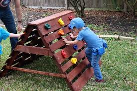 pallets made in to a climbing wall for