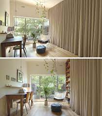 Ceiling Curtain Hides A Wall Of Storage
