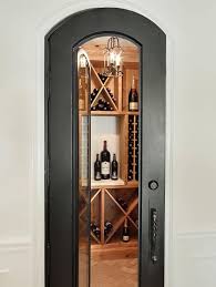 Wine Room With Arched Glass Door And