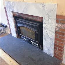 cover a brick fireplace with wood