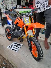 orange 50 cc dirt bike for kids below