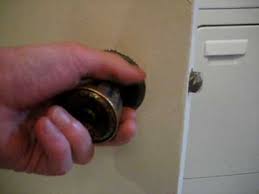 This hole will commonly be located in the center of the door handle. Pinhole Door Knob Unlock With Pin Youtube