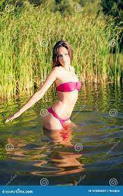 Sensual Pretty Young Lady Exposing Her Body To Stock Photo - Image of  green, female: 57856684
