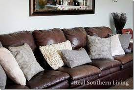 leather sofa with throw in stock