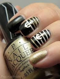 bold black and gold nautical nail art