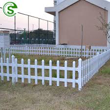white pvc picket fence panel lawn