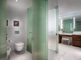 spa bathroom with glass partition walls