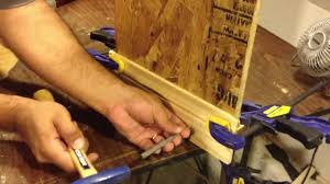 baseboard using a hammer and nails