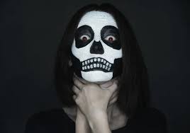 scary woman with skull make up stock