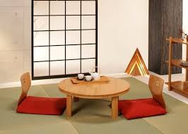Some thin cushions are arranged around the ottoman. Japanese Table Japanese Dining Table Beautiful Dining Rooms Fine Dining Table Setting