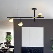 Mid Century Modern 3 Light Linear Ceiling Light In Black And Brass With Glass Globes For Dining Room Kitchen Island Restaurant