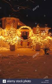 House With Christmas Lights Ak Winter Snow Stock Photo