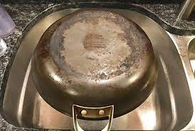 to clean calphalon hard anodized pans