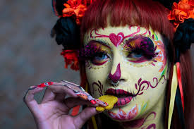 a woman with a sugar skull makeup and