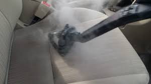 steam cleaning a car upholstery seat