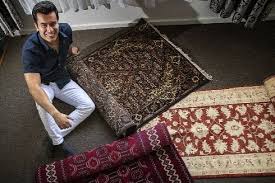 young afghan refugee starts persian rug