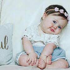 Portrait of happy beautiful happy youngwoman relaxing in park. Babiess Cute Baby Pictures Cute Baby Videos Cute Baby Girl Pictures