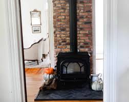 The hearth protects the floor from errant embers that could burn wood or scorch carpet. Diy Hearth Pad Farmhouse On Boone