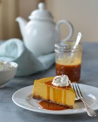 Pumpkin Cheesecake With Gingersnap Crust And Caramel Sauce