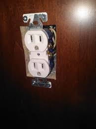 receptacle mounted to cabinet against