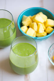 tropical kale smoothie is packed with tons of healthy kale mango and pineapple add a