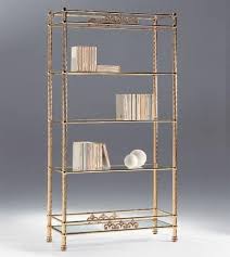 brass bookcase with glass shelves for