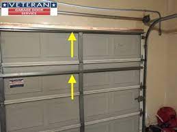 strut or replace my garage door section