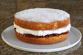 queen cake with whipped cream and jam