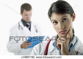 Doctor Thinking And Doctor Reading Medical Chart Stock Image