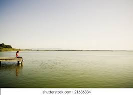 young woman sitting dock bay stock