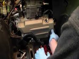 change the oil on a honda rancher