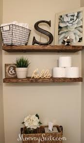The bathroom has an open shelving unit with an insert for accessories. 19 Amazing Diy Farmhouse Bathroom Decorating Ideas