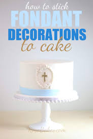 how to stick fondant decorations to cake