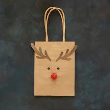 I thought it was adorable. Free Photo Top View Of Christmas Gift Bag With Reindeer Decoration