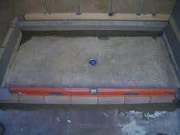 install a shower pan on concrete floor